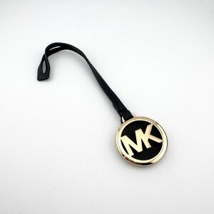 Michael Kors Black and Gold MK Round Logo Charmed Luggage / Hang Tag